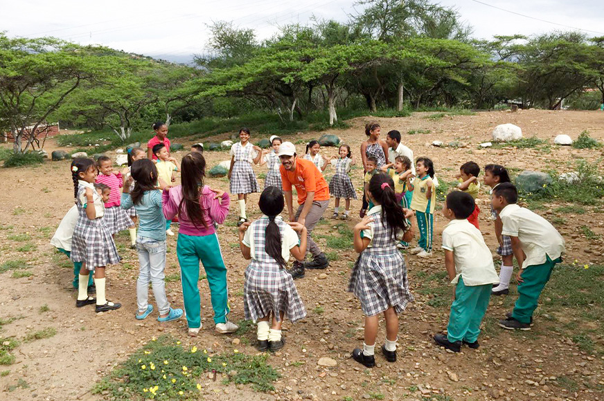 A group of Venezuelan refugee children share a time of laughter and games in Colombia.