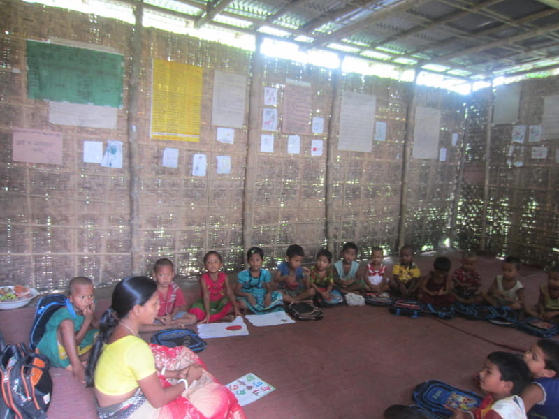 Children participating in a group learning activity inside a classroom.
