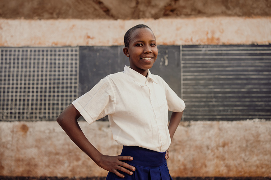 A serious portrait of Glory dressed in her school uniform.