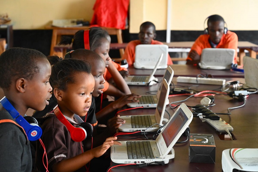 Young students are using white laptops (Kenya, 2022)
