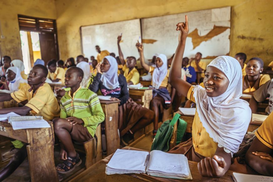 Hands Up in a Busy Classroom