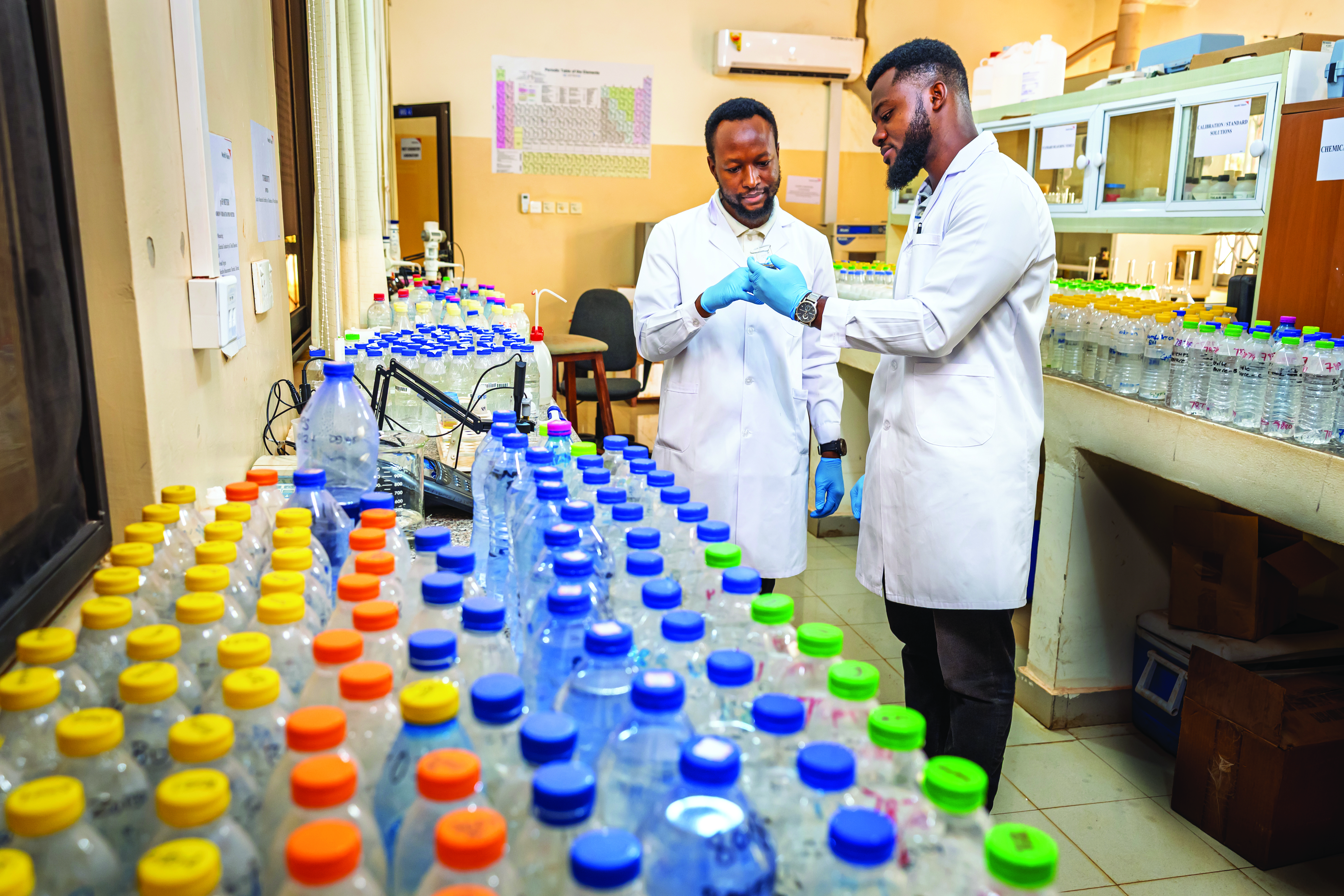 World Vision lab technicians working at the World Vision Regional Water Quality Laboratory, in Savelugu, Ghana,