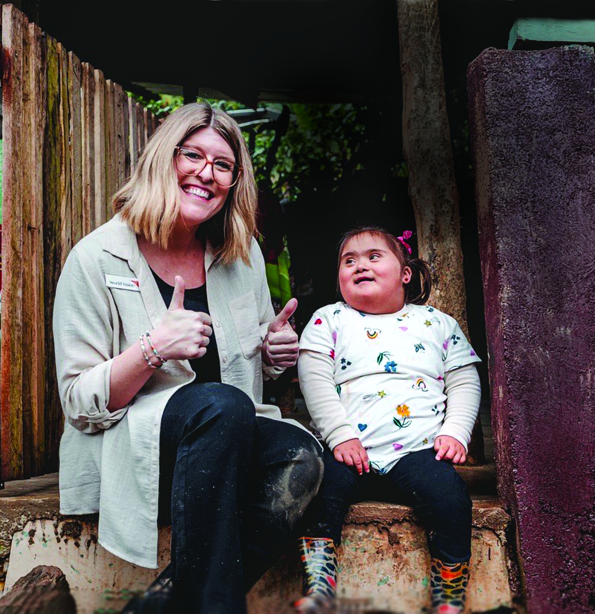 World Vision Canada President Allison Alley gives a thumbs up with Anna Victoria.
