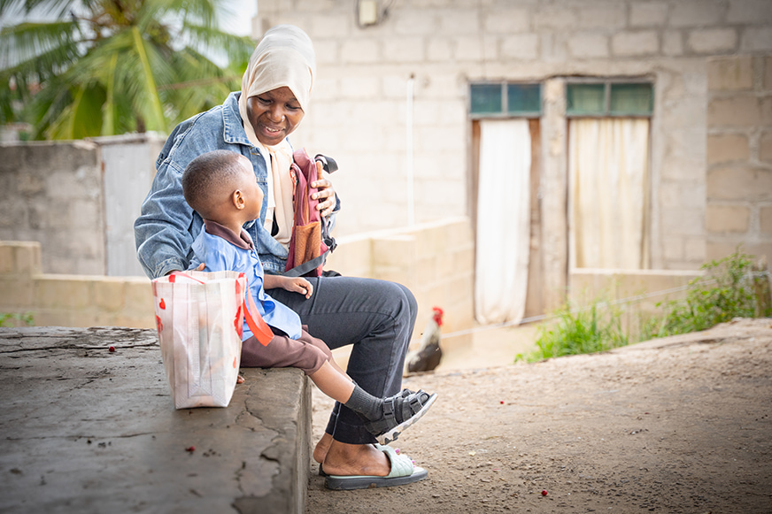 Amani in a quiet moment with her son
