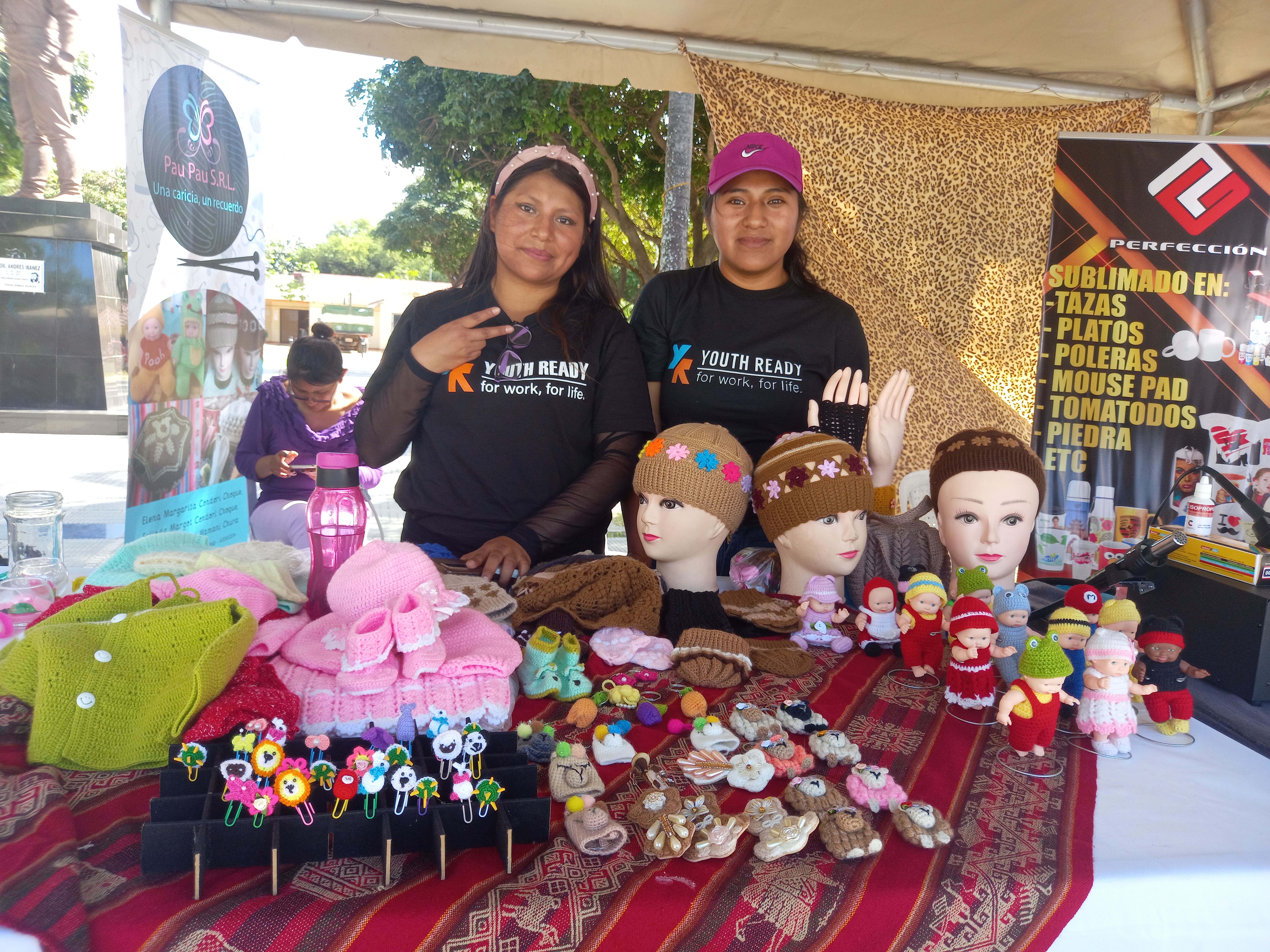 PAU PAU staff selling products at a local fair