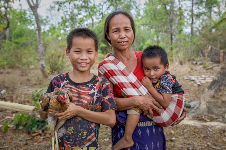 world-vision-canada-mother-and-two-sons-outside-a-farmhouse