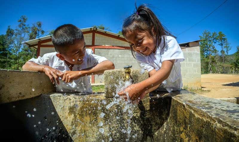 Northern Triangle - Boy and girl washing hands