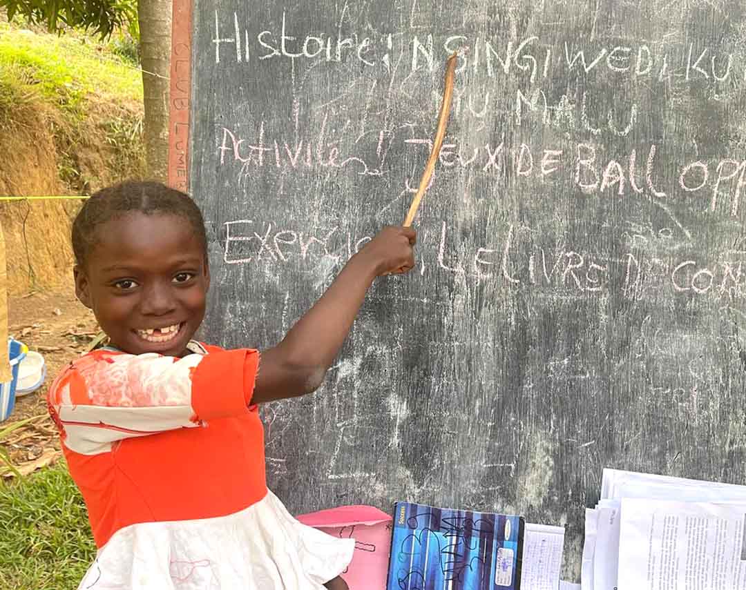 Severine points at the chalk board.