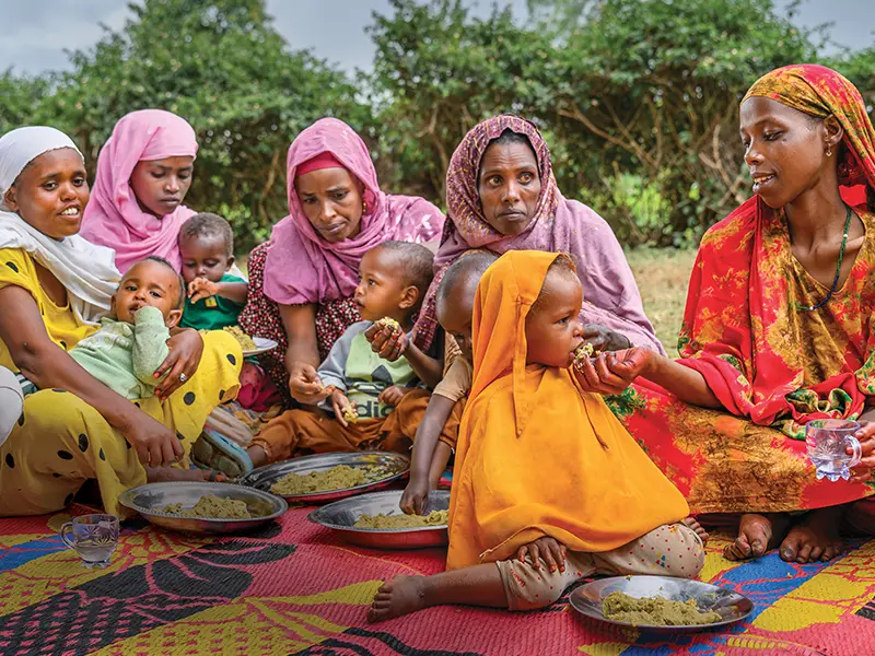 about-us-women-feeding-their-children.webp