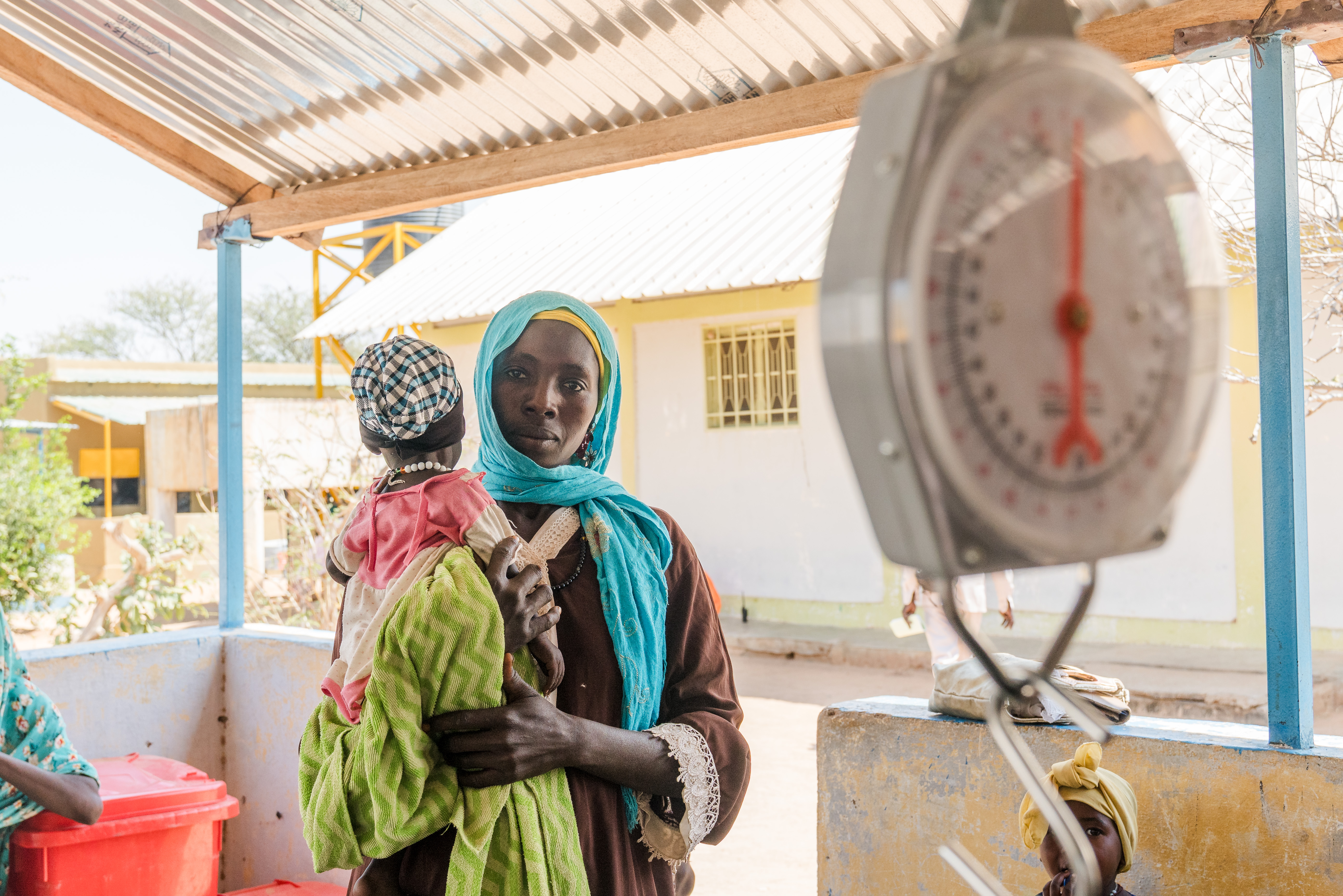 A Sudanese mother brings her baby to the clinic.