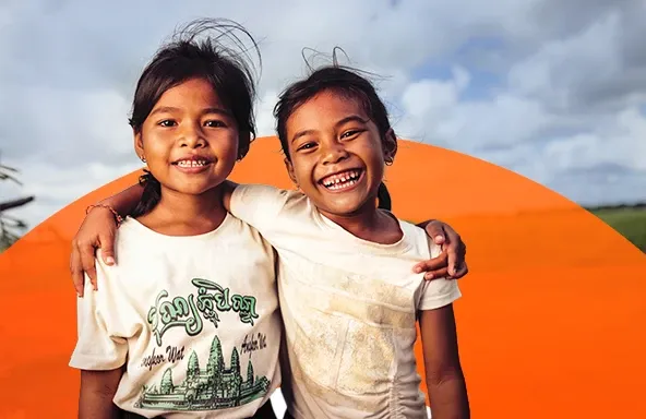 world-vision-canada-our-work-two-girls-smile-and-laugh.webp