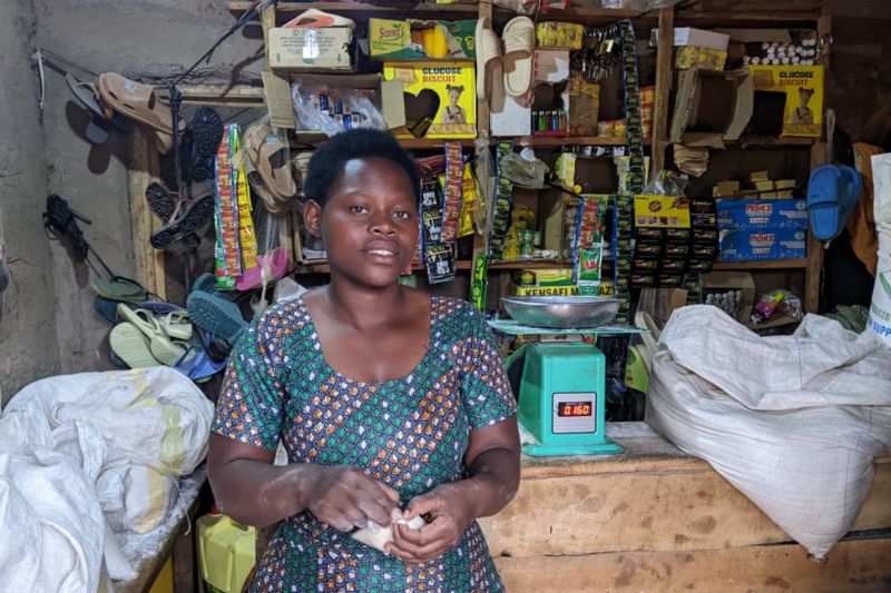 Angelique stands in her shop that she started with help from youth training.