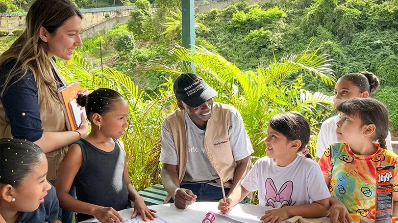 world-vision-canada-about-us-staff-outdoor-activity-with-children.webp