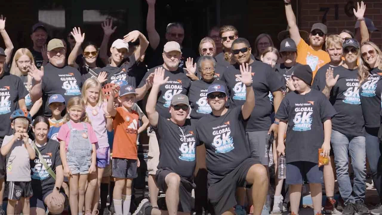 Group of people standing for a global 6K.