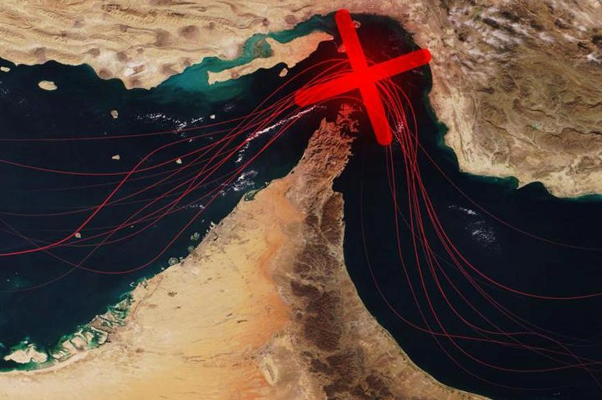 The Strait of Hormuz as seen from space with a red X superimposed to represent it's blocked or closed.