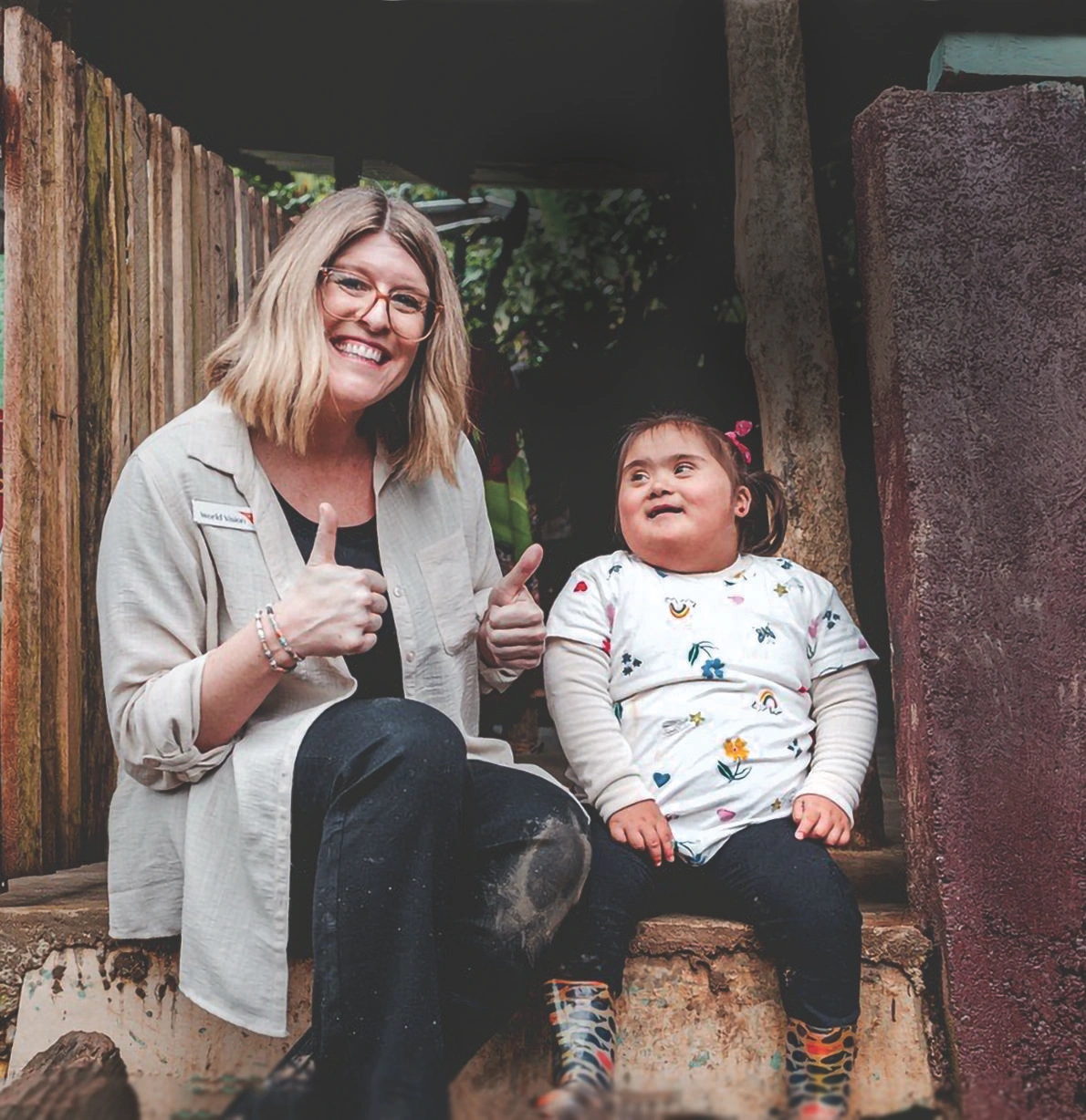 World Vision Canada President Allison Alley gives a thumbs up with Anna Victoria.
