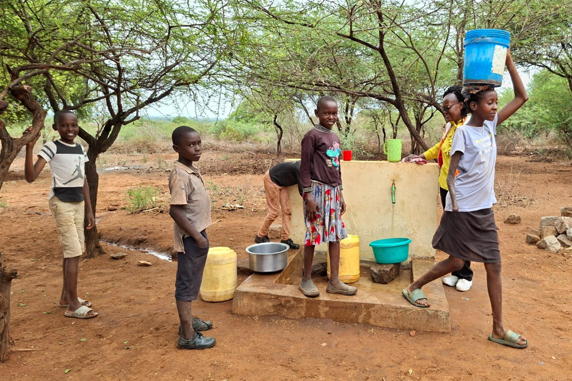 Children Collect Water in Riata