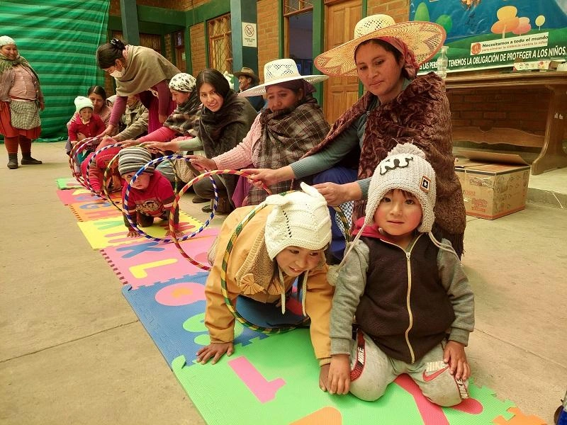 A group of toddlers participate in play-based learned in Koari, Bolivia.