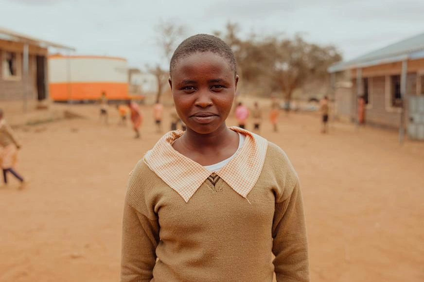 cutting-ties-with-fgm-girl-standing-in-schoolyard