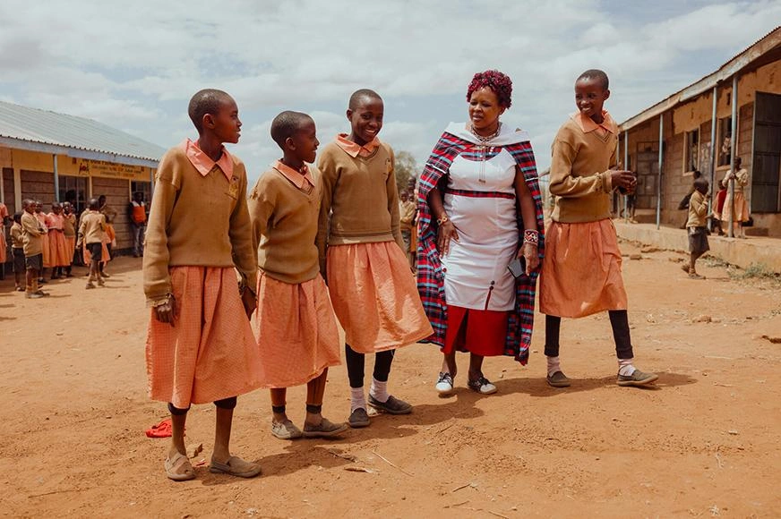 cutting-ties-with-fgm-woman-and-four-girls-walking