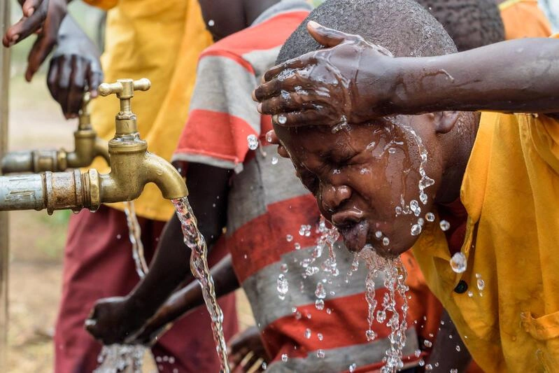 clean-water-safe-water-child-washes-face
