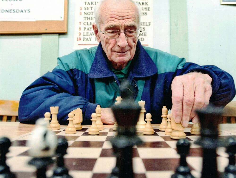 legacy-giving-arie-kamp-playing-chess