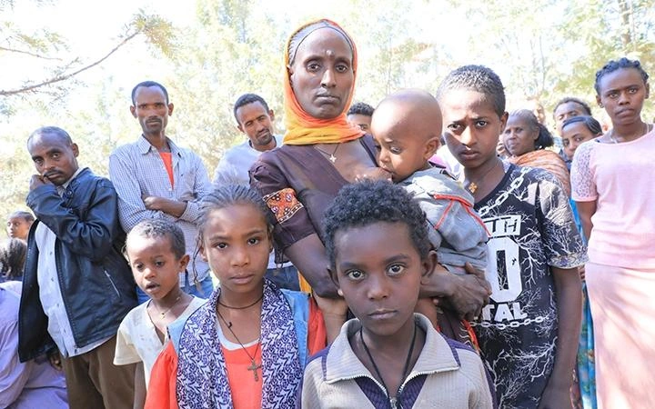Refugee crisis in Ethiopia: A refugee from Tigray with her children