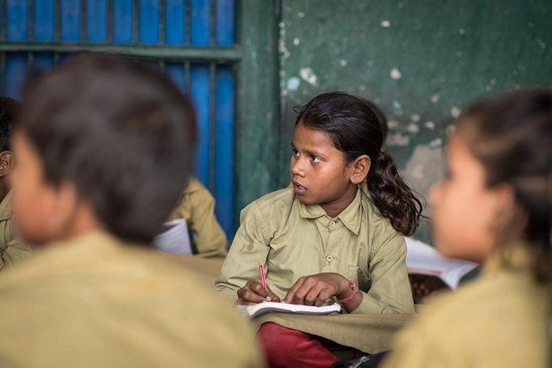 Sponsored child Varsha, 11, attends school in an open-air classroom in India. Her family’s poverty and cultural traditions form a combination ripe for child mar