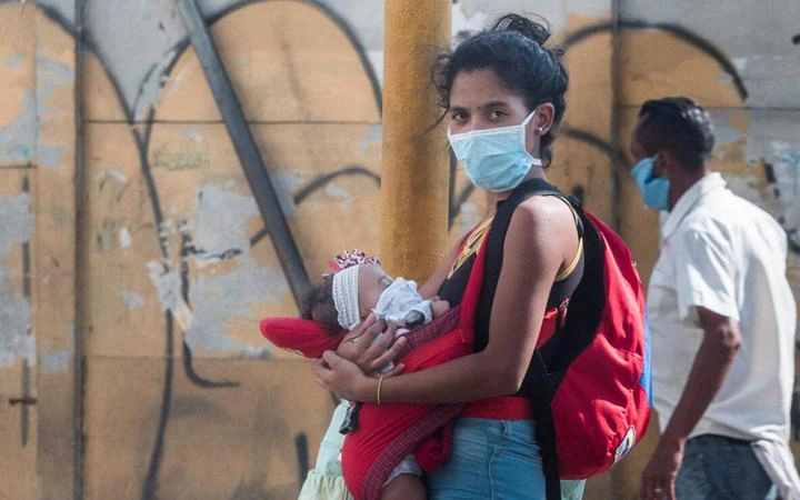 social-justice-guide-woman-holding-a-baby