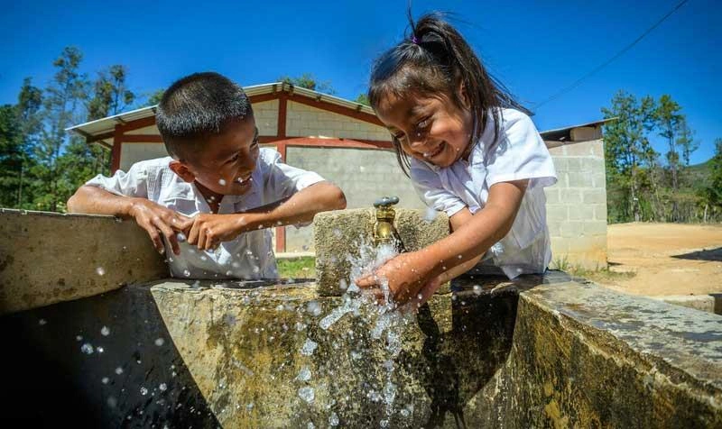 Northern Triangle - Boy and girl washing hands