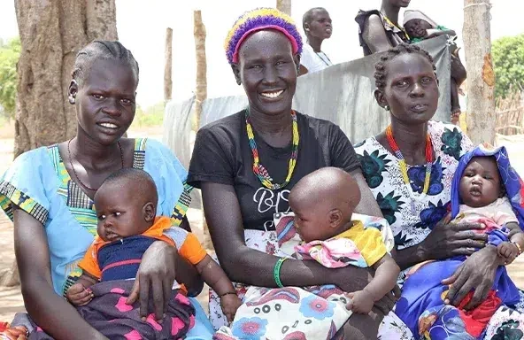 Mothers and their babies waiting for nutrition services at Maliai Primary Health Care Unit in Gogrial East, Warrap State. (South Sudan, 2024)