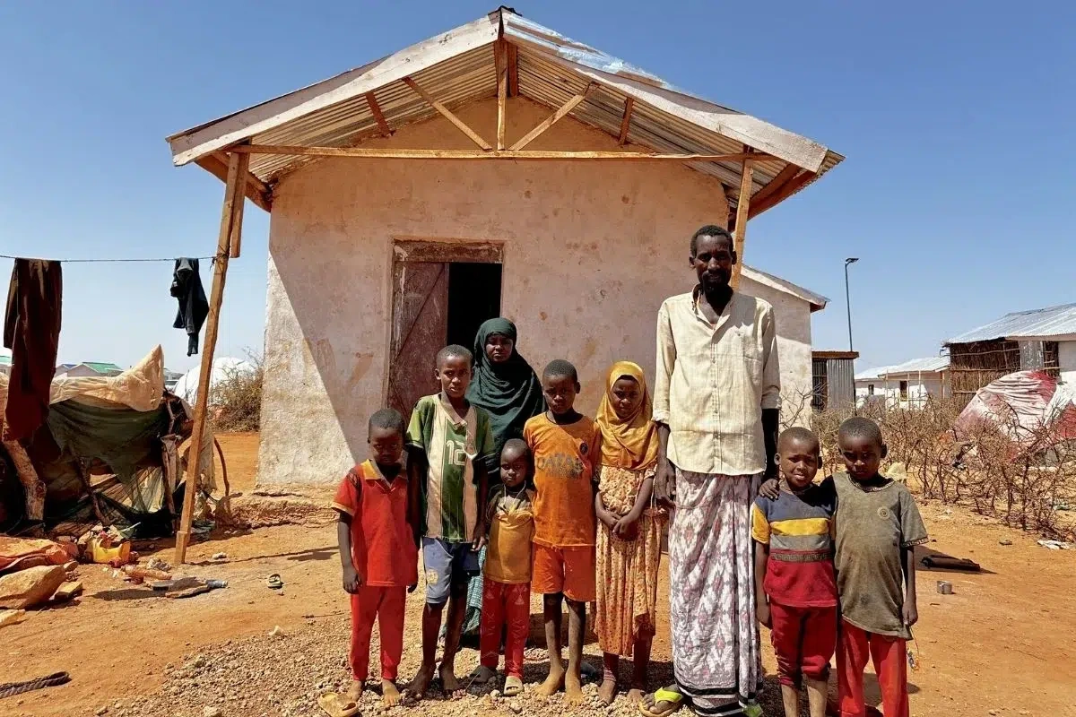 Refugee father stands in front of the Child Friendly Space in Somalia.
