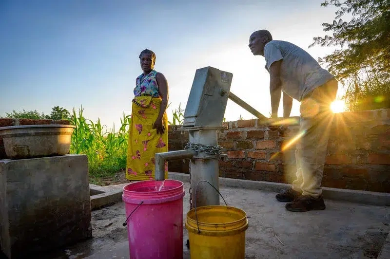 Family pumps clean water for their house.