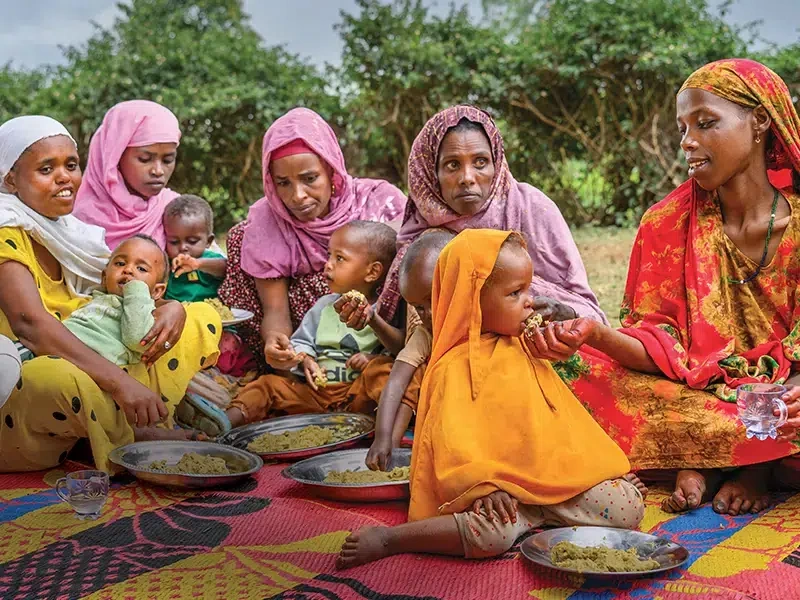 These mothers participated in a community program led by health workers and volunteers, where they learned how to prepare nutritious food for their children.