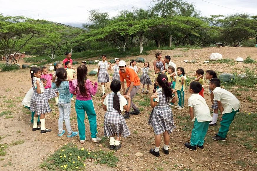 A group of Venezuelan refugee children share a time of laughter and games in Colombia.