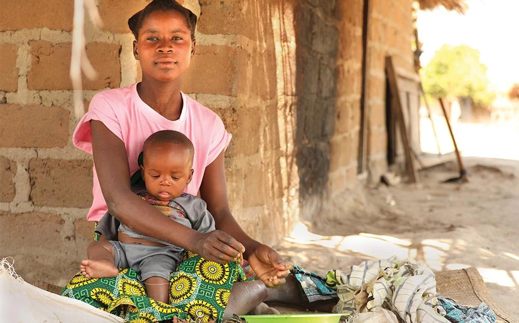 new-purpose-young-woman-sitting-with-small-child.jpg