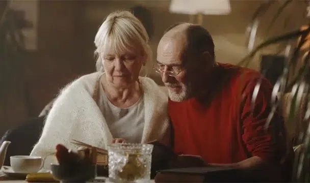 An old couple browses their plan together.