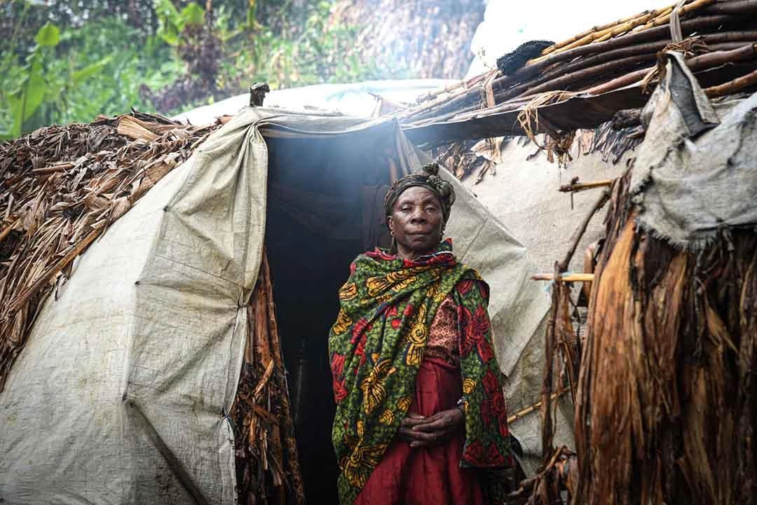 relief-headline-strong-woman-stands-by-sticks-tent.jpg