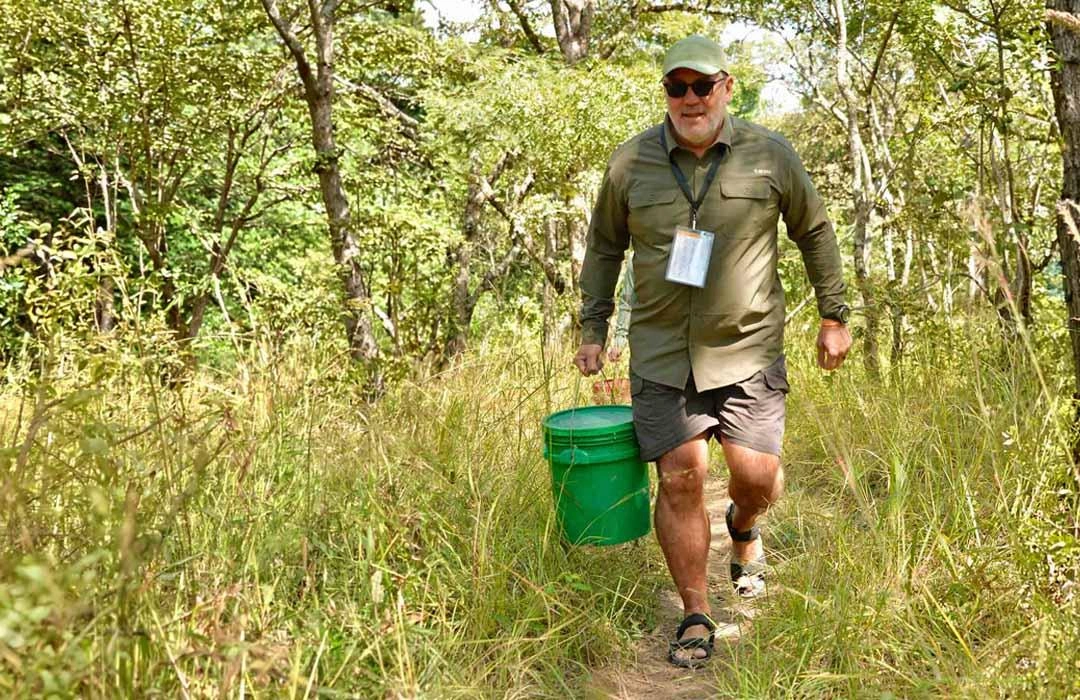 Rocky on the trek to carry water