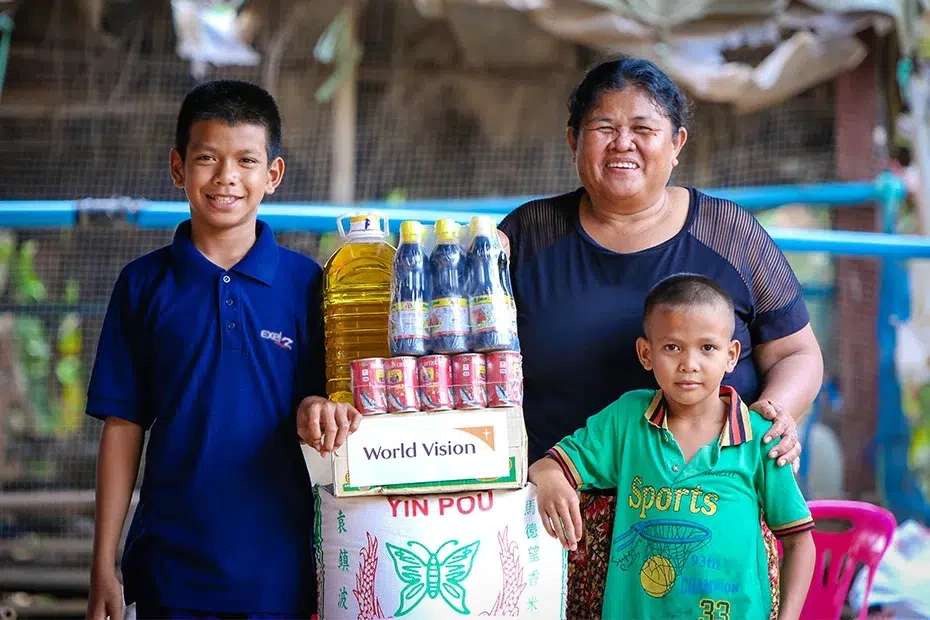 Two boys with their grandmother received family food basket from World Vision.