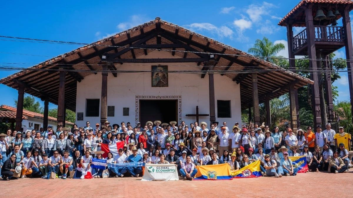 Global Youth Summit attendees gathered outside the venue for a group photo.
