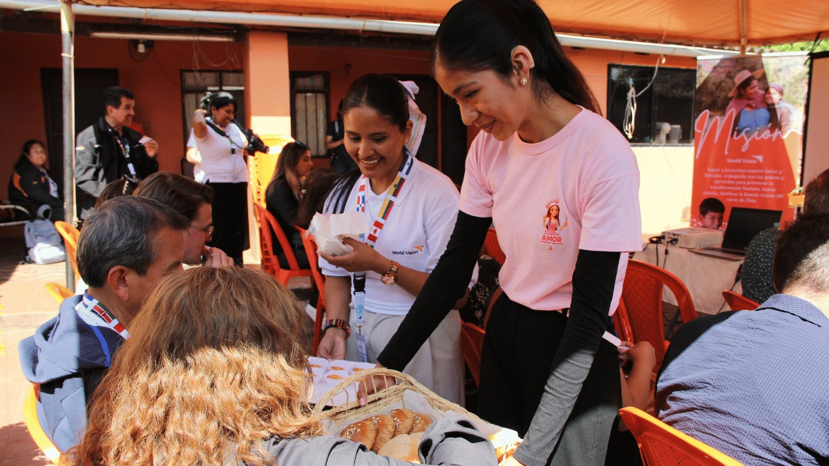 Andrea Rivero shares an assortment of baked goods from her bakery, Dulce Amor, at the Global Youth Summit in Santa Cruz, Bolivia.