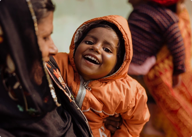 A young girl laughing.